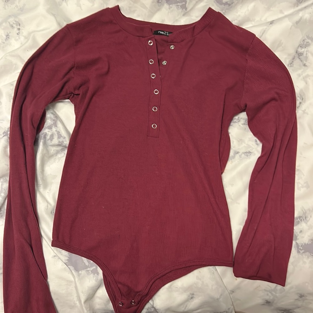 Long sleeve burgundy bodysuit.
